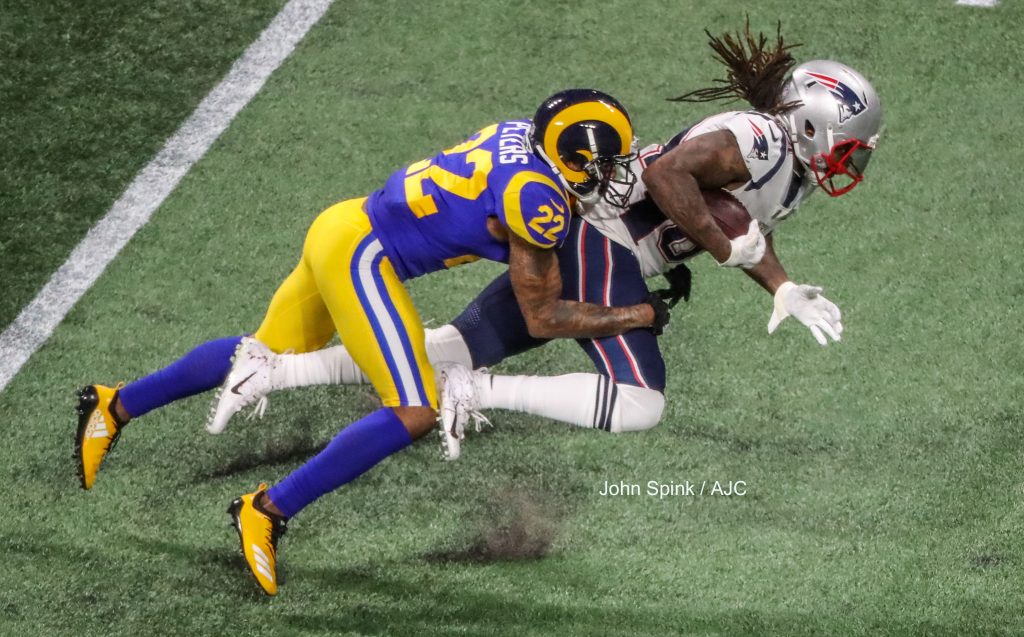 John Spink/Atlanta Journal-Constitution - New England Patriots wide receiver Cordarrelle Patterson (84) makes a catch over Los Angeles Rams cornerback Marcus Peters (22) in the second quarter.