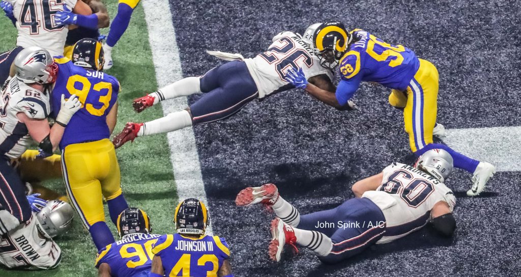 John Spink/Atlanta Journal-Constitution - New England Patriots running back Sony Michel (26) rushes for a fourth quarter TD to take the lead and the win.