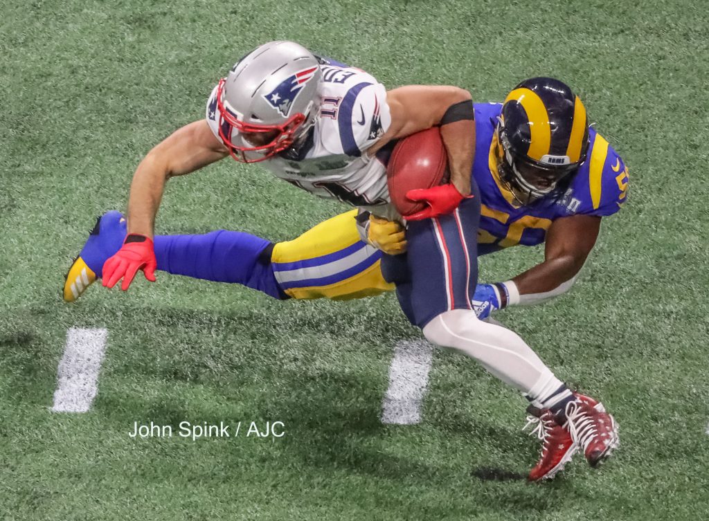 John Spink/Atlanta Journal-Constitution - New England Patriots wide receiver Julian Edelman (11) returns a punt in the first quarter. The New England Patriots played the Los Angeles Rams in the Super Bowl at Mercedes-Benz Stadium in Atlanta. 