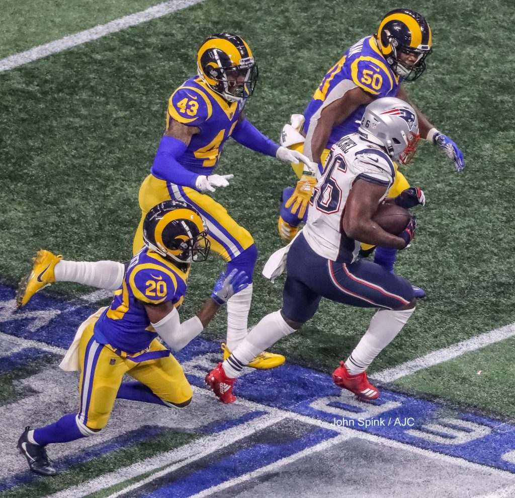 John Spink/Atlanta Journal-Constitution - New England Patriots running back Sony Michel (26) gets a first down in the fourth quarter. The New England Patriots played the Los Angeles Rams in the Super Bowl at Mercedes-Benz Stadium in Atlanta.    