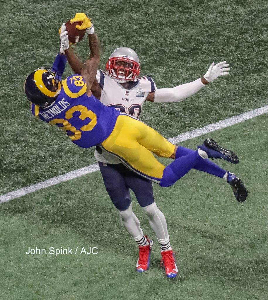 John Spink/Atlanta Journal-Constitution - Los Angeles Rams wide receiver Josh Reynolds (83)(left) can't hold onto a pass as New England Patriots cornerback Jason McCourty (30) knocks it out of his hands during 2nd quarter action.