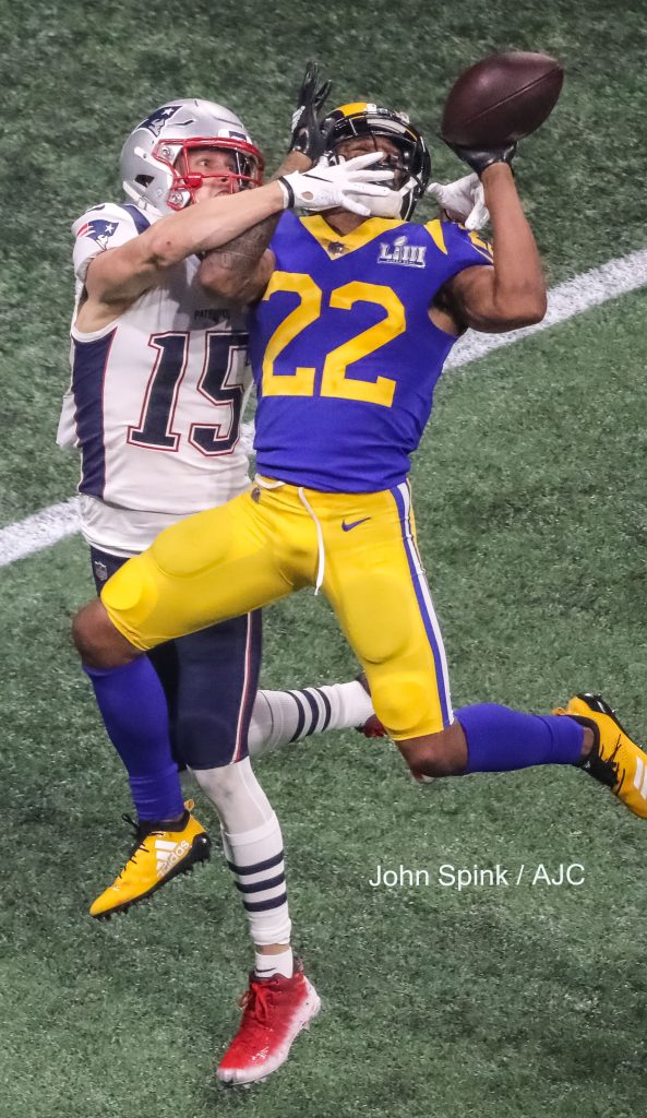 John Spink/Atlanta Journal-Constitution - New England Patriots wide receiver Chris Hogan (15)(left) can't get to this pass as Los Angeles Rams cornerback Marcus Peters (22)(right) knocks the ball away during the 3rd quarter .