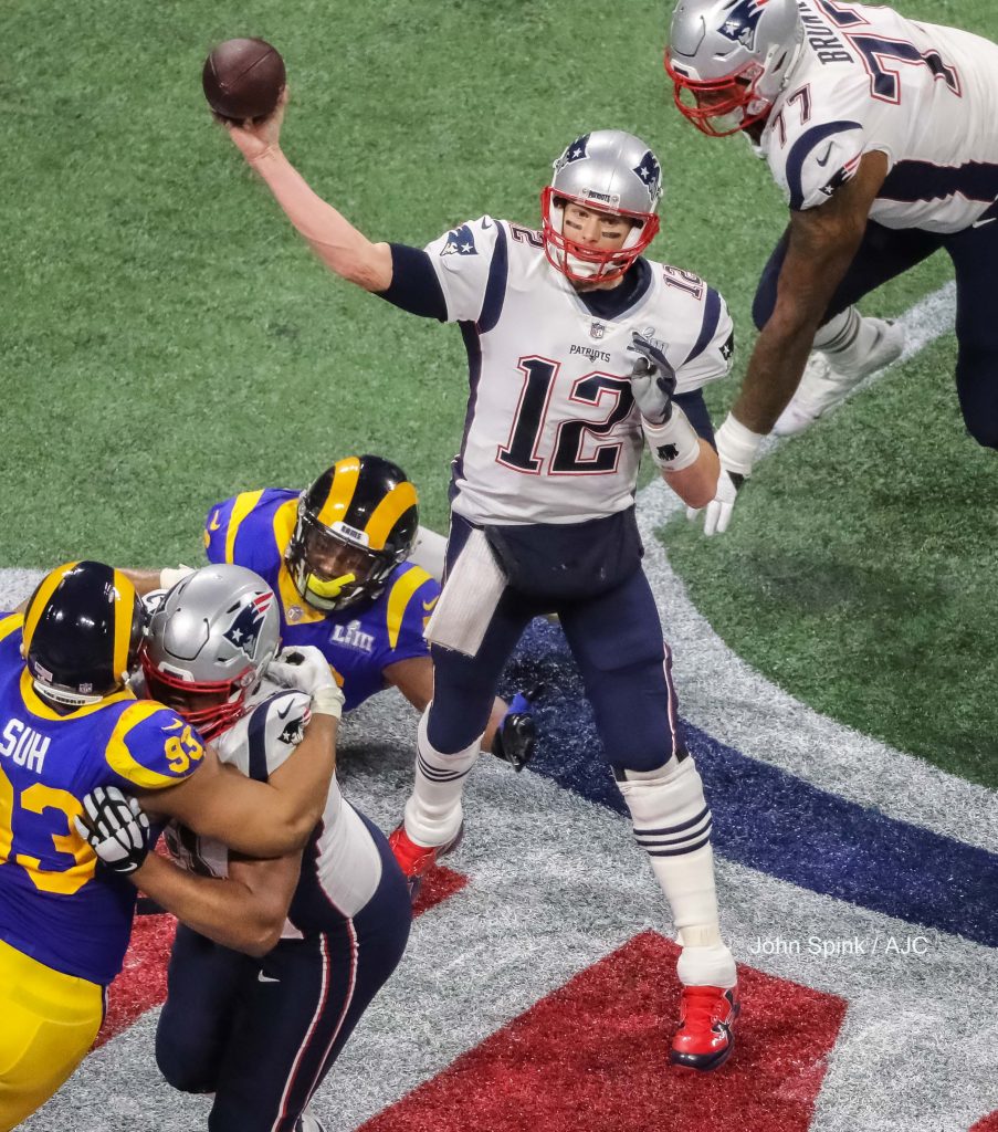 John Spink/Atlanta Journal-Constitution - New England Patriots quarterback Tom Brady (12) throws a pass in the second quarter. 