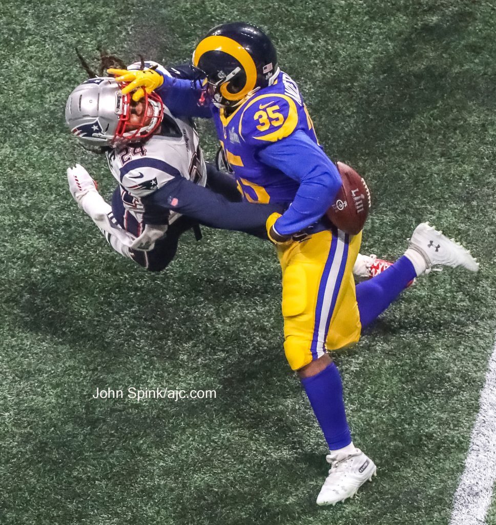 John Spink/Atlanta Journal-Constitution - New England Patriots cornerback Stephon Gilmore (24) gets a stiff arm from Los Angeles 
Rams running back C.J. Anderson (35) in the fourth quarter.  